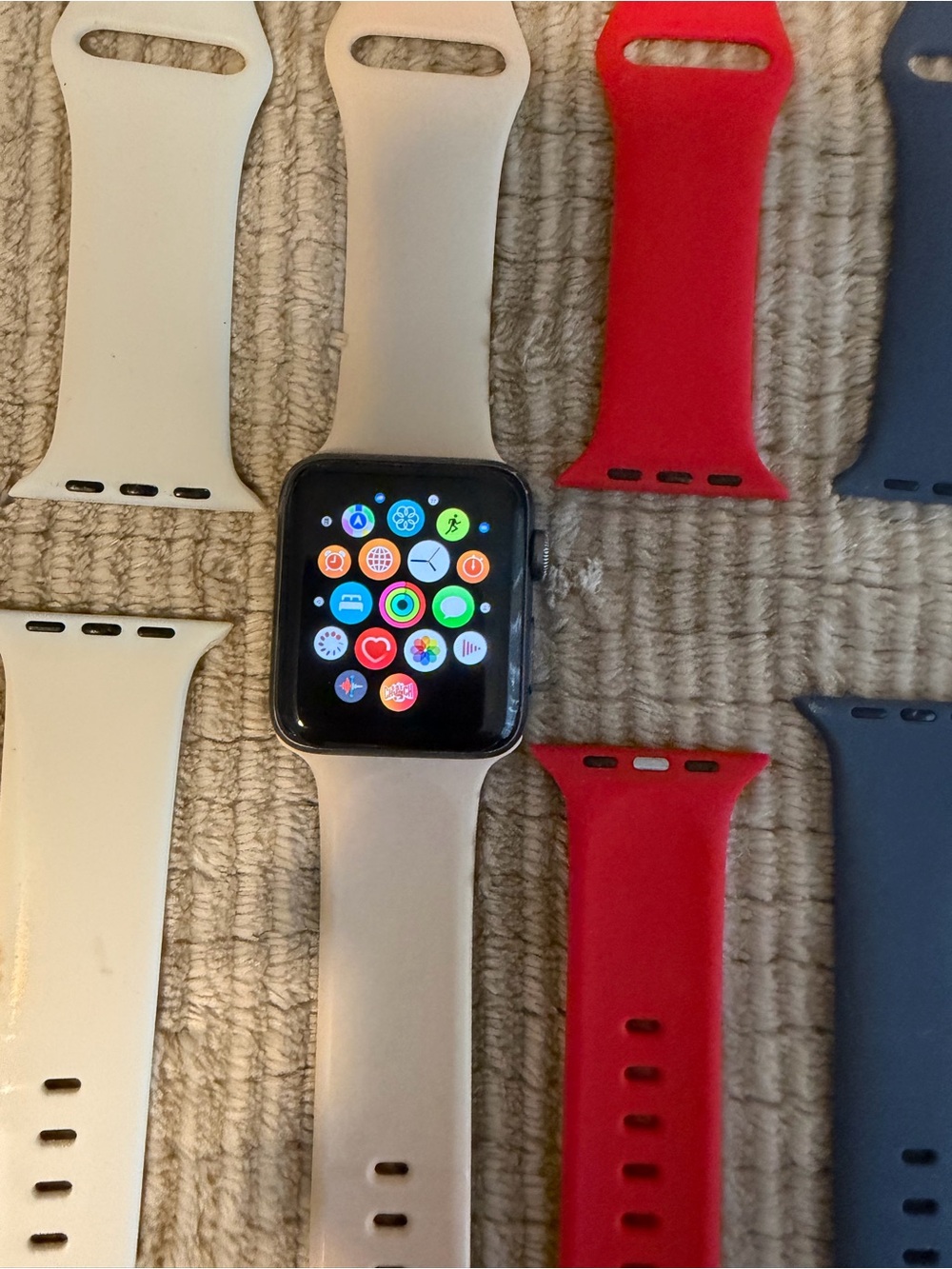 Apple Smartwatch with White, Red, and Blue Sport Bands